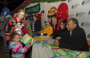 Dr. Ben and Candy Carson Donate and Sign Why America Matters Children’s Books at Schellville Ben Carson giving Why America Matters´ books to children at Schelville DE