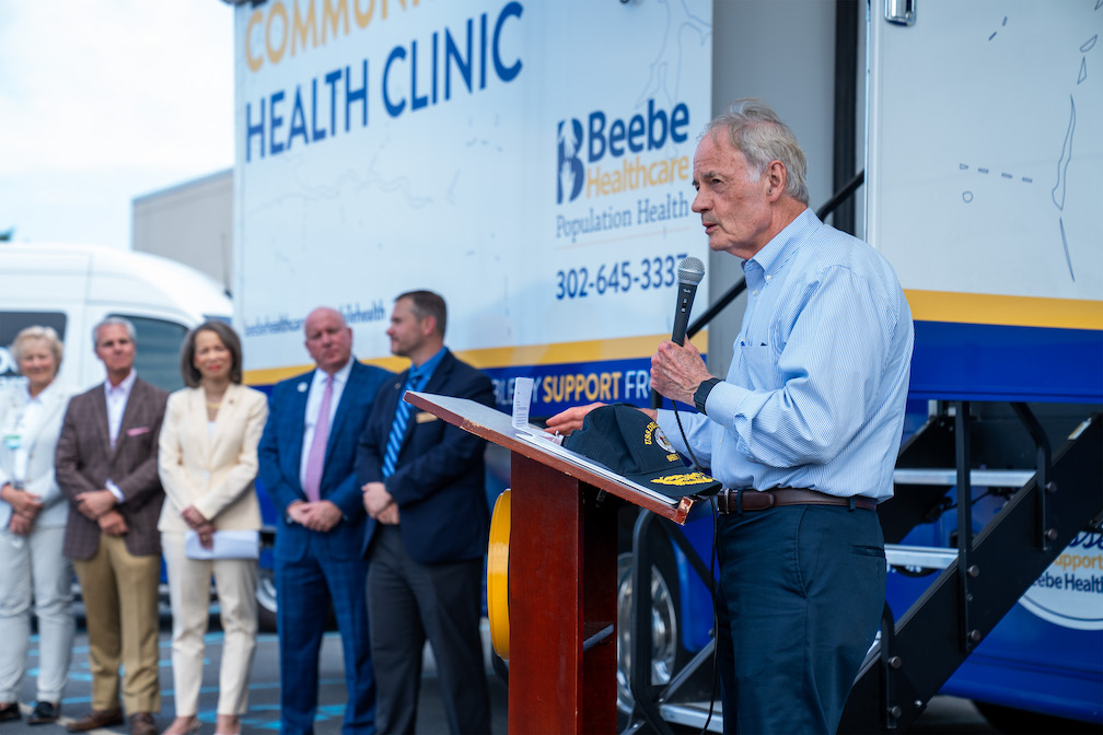 U.S. Sen. Tom Carper addresses the audience in front of Beebe’s Community Mobile Health Clinic on Friday, June 7.  

 