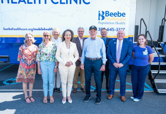 From left to right, Karen Duffield, Beebe Medical Foundation, Gwen Davis, FNP, PMHNP, on the Mobile Health Unit, Kay Young, Beebe Medical Foundation, Rep. Lisa Blunt Rochester, Mike Meoli, Board Chair, Sen. Tom Carper, Bill Chasanov, DO, Chief Health Systems Design Officer, Tom Protack, President, Beebe Medical Foundation, and Emily Hains, RN, on Behavioral Health Unit.