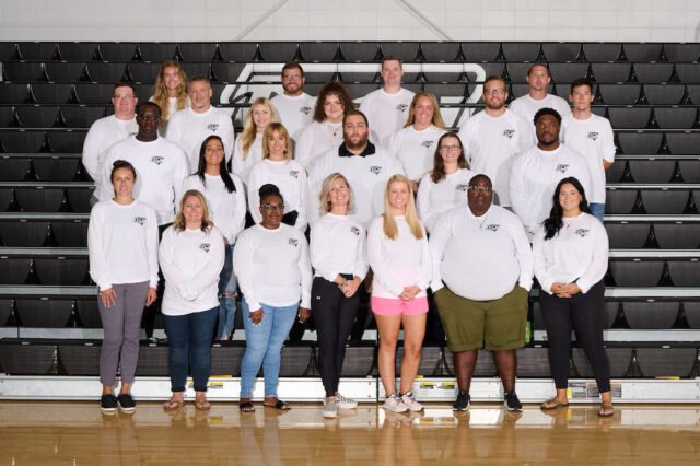 Photo: Alumni Staff Members at Sussex Tech Front Row L-R: Cassidy Marvel, Olivia Trudeau, Tynia Hopkins, Alison Knox, Darian Mitchell, Grace Batten, Shannon Brown Second Row L-R: Jacques Bowe, Lindsay Mulrine, Amy Calhoun, Josh Kunde, Katie Hiller, Kani Kane Third Row L-R: Derek Magee, John Jones, Kelsey Mulford, Lauren Mahetta, Krista Schirmer, TJ Dukes, Matthew Drumheller Back Row L-R: Amber Swingle, Brad Ellingsworth, Sam King, Kyle Furniss