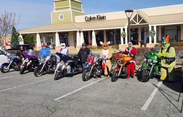 Pausing for a photo opportunity during a recent visit to Tanger Outlets Seaside are (l-r) Pete Abel (Yukon Cornelius), Tom Beutner (Frosty), Kevin McDermott (Scrooge), Jose Arroyo (Rudolph), Josh Sweeney (Santa) and Jason Sweeney (Grinch). SUBMITTED PHOTO