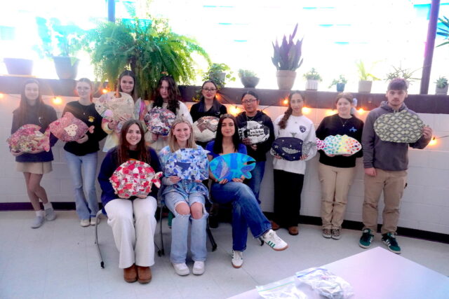 Sussex Academy students displaying their paper mache fish are in back (l-r) Caroline Olewiler, Kadence King, Capucine Duvert, Eva Boos, Mary Lu Sanchez, Briseyda Ortiz Miguel, Gigi Miranda, Skyla Edmondson and Evan Spanos. In front are Bella Crisci, Hannah Purse and Francesca Fratini (Photo courtesy Sussex Academy)