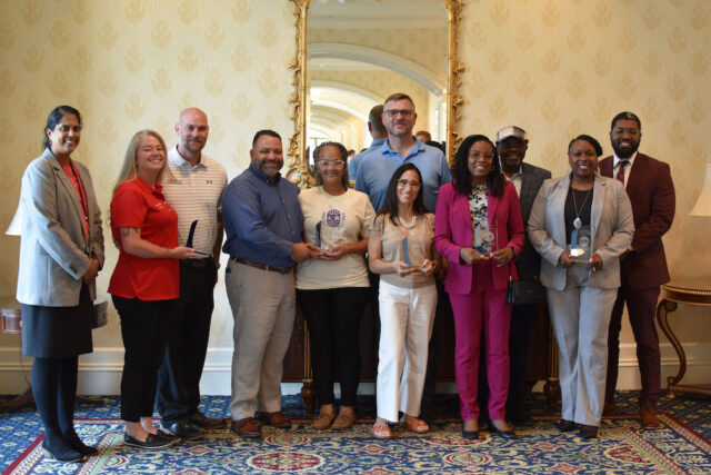 Entrepreneur Group Photo – (L to R) Secretary of State Charuni Patibanda-Sanchez, Nicole & Matt McCarville (American Fire Protection), William & Rosa Donato (Harvey Haven Lavender Farms), Jenny and Jeremy McEntire (Bayside Gymnastics), Mbwidiffu Dibal & spouse (The Menopause Clinic), Dierdra Oretade-Branch (Introspection Counseling) and Division of Small Business Director CJ Bell