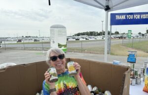 14th Annual Food Lion Feeds Hunger Relief Day Nourishes Neighbors in Need Food Bank of Delaware Community Resource Manager Sue DeNardo shows off donations collected at last year’s Delaware State Fair. (Photo credit: FBD)