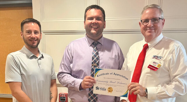 SC Habitat for Community Director of Development Ricky presenting a Certificate of Appreciation. Pictured from left to right are: Tyler Stetz, Business Development Manager of Community Bank Delaware, Ricky Pollitt, Director of Development for SCHFH, and Jack Riddle, President of Community Bank Delaware. (Photo courtesy SC Habitat for Humanity).