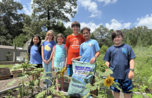 Sussex Academy Elementary students harvest 54 lbs of produce from school garden Gathered by the blooming sunflowers in the Sussex Academy Elementary garden are (l-r) Melissa Gomez-Borrayes, Milena Costello, Odette Frankum, Sawyer Hudson, Nolan Thomas and Jessen Wobeter.