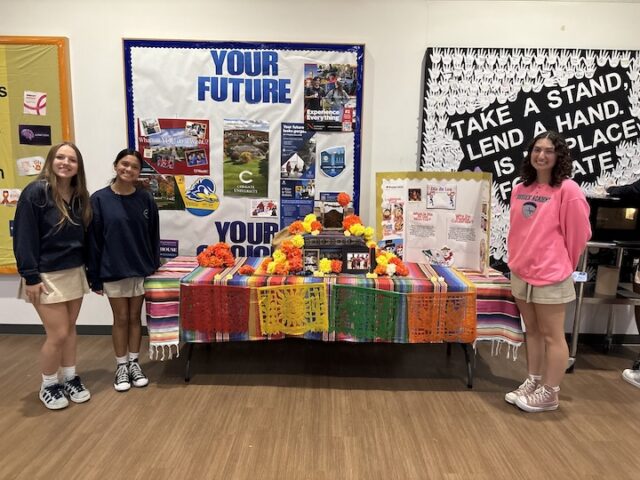 Day of the Dead: Sussex Academy World Language Honor Society members (l-r) Leni Kuska, Priya Haldar and Karina Lopez display the ofrenda they created to observe the Day of the Dead (Photo cortesy Sussex Academy)