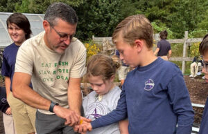 Sussex Academy’s Ott speaks on gardens at statewide education event Sussex Academy Elementary math and science teacher and garden coordinator Don Ott was a featured speaker at Healthy Foods for Healthy Kids’ Meet Our Heroes event Nov. 5. Ott, second from left, pours seeds into the hands of young gardens (l-r) Rowan Kirk, Stihl Thompson, Daisy Huerta, Colton Lane and Cameron Evans as they prepare the school’s fall garden