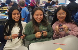 Sussex Academy students mark Veterans Day by folding flags for soldiers Flag 2: Sussex Academy students (l-r) Sofia Morales-Chaj, Luciany Perez-Perez, and Anna Liang create pocket flags for deployed and deploying U.S. troops.