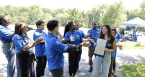 Intl. WeLoveU Foundation Hosted Mother’s Day Tree-Planting in Delaware/La Fundación Internacional WeLoveU organizó una plantación de árboles por el Día de la Madre en Delaware State Representative Sophie Phillips with the WeLoveU volunteers after reading the Proclamation. (Photo HOY en Delaware)