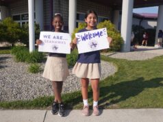 Legislators, leaders convene at annual Sussex Academy showcase Sussex Academy Elementary students Bethsaida Bellevue, left, and Sayuri Perez Perez welcome guests to the school’s second annual open house for elected leaders and community representatives.