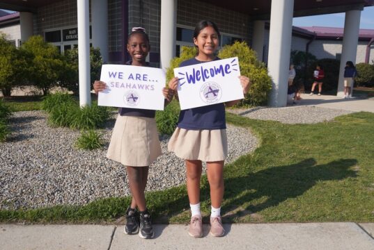 Legislators, leaders convene at annual Sussex Academy showcase Sussex Academy Elementary students Bethsaida Bellevue, left, and Sayuri Perez Perez welcome guests to the school’s second annual open house for elected leaders and community representatives.