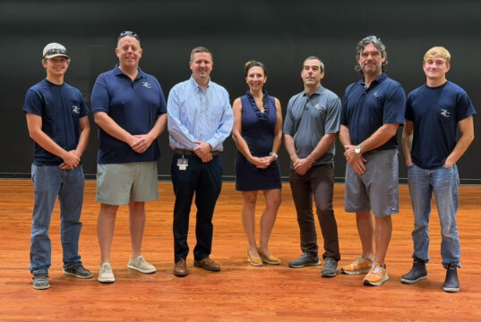 Sussex Academy theater floor shines thanks to Zorzi Creations donation Photo cover (Courtesy of Sussex Academy): Over the summer, Zorzi Creations completely refinished the stage floor at Sussex Academy, at no charge to the charter school. Gathered on the newly refinished theater stage are (l-r) Tyler Smith, Dave Bryan, Head of School Kyle Bentley, Lindsay Zorzi, Mario Zorzi, Mike Zorzi and Ryan Beard.