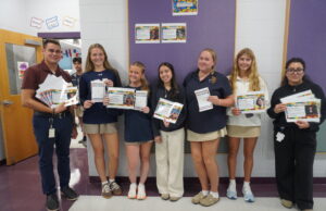 Sussex Academy students mark Hispanic Heritage Month with educational game Photo caption: Members of the Sussex Academy World Language Honor Society launched a bingo game to celebrate Hispanic Heritage Month. Gathered are (l-r) advisor Nico Cáceres, Caroline White, Olivia Dickerson, Rossy Ángel-Herrera, Reagan Hastings, Brooklyn Montgomery and advisor Emily Gutiérrez. (Photo: Courtesy of Sussex Academy)